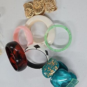 Bundle of seven bracelets.